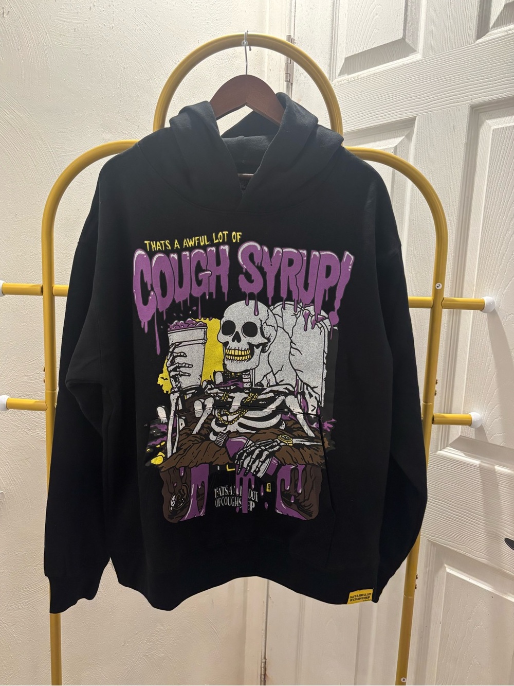 Black Graphic Hoodie with Purple 'Cough Syrup' Design